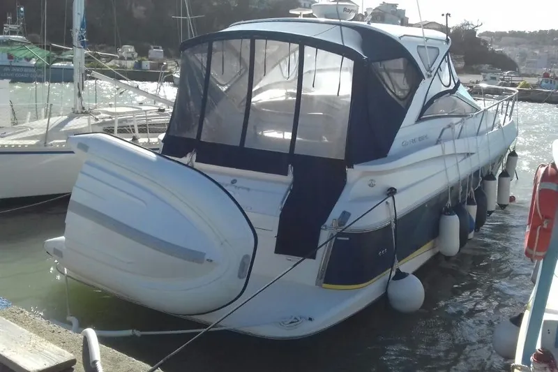  Yacht Photos Pics 2007 Regal Commodore 4060 yacht docked at marina with protective cover.