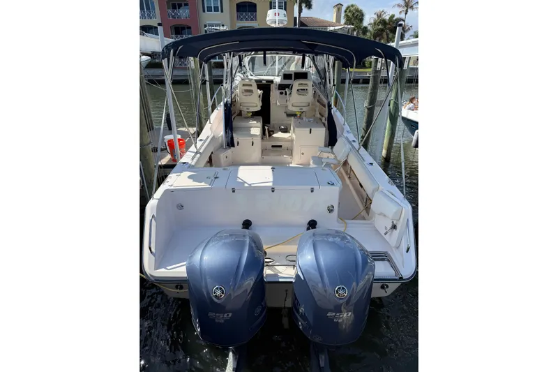  Yacht Photos Pics 2009 Grady-White Marlin 300 boat with dual Yamaha outboard engines docked at marina.