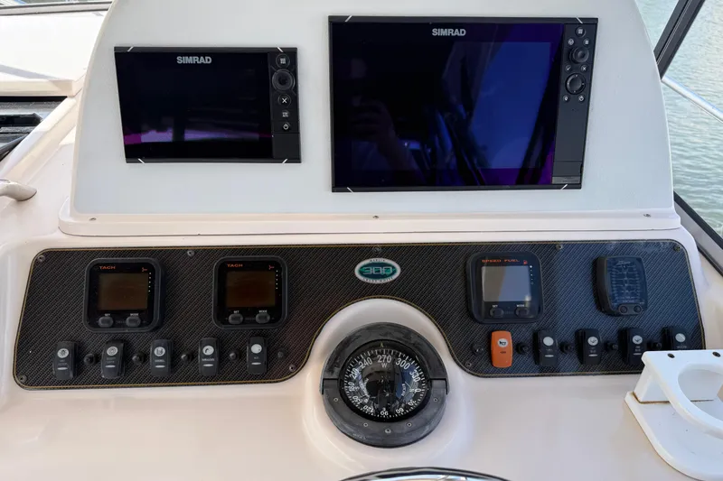  Yacht Photos Pics Dashboard of 2009 Grady-White Marlin 300 with Simrad displays and navigation instruments.