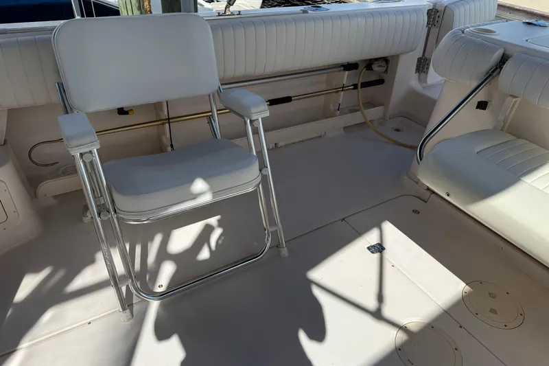  Yacht Photos Pics 2009 Grady-White Marlin 300 boat interior with white seating and fishing chair.