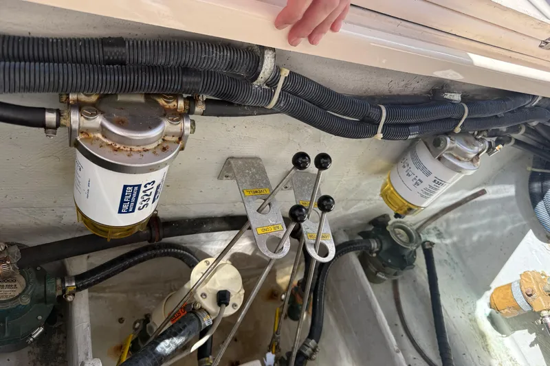  Yacht Photos Pics 2009 Grady-White Marlin 300 engine compartment with fuel filters and control levers.