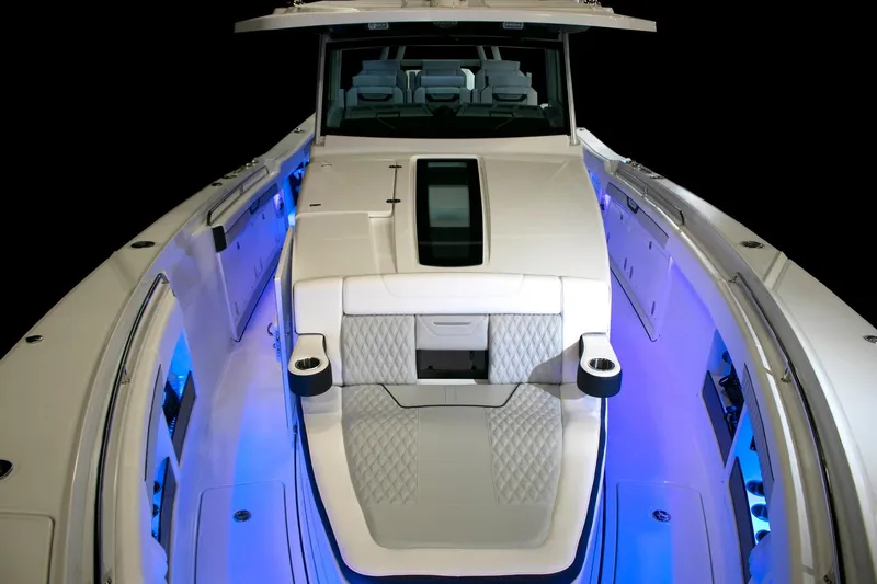  Yacht Photos Pics Manufacturer Provided Image: 2026 Blackfin 400 CC boat interior with blue LED lighting and luxurious seating.