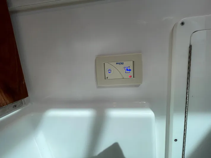  Yacht Photos Pics Control panel on 2022 Bertram 39 CC boat interior wall.