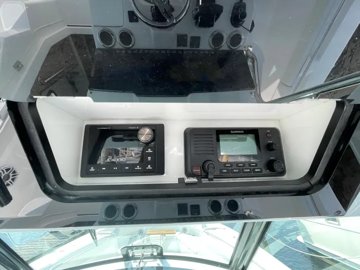  Yacht Photos Pics Control panel of 2022 Bertram 39 CC boat with navigation and communication systems.