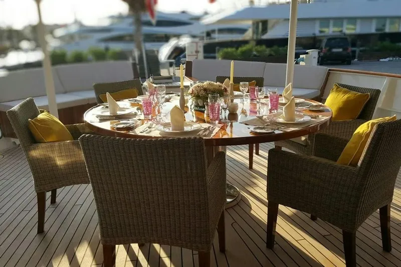  Yacht Photos Pics Elegant outdoor dining setup on a 1975 Custom 39M yacht deck.