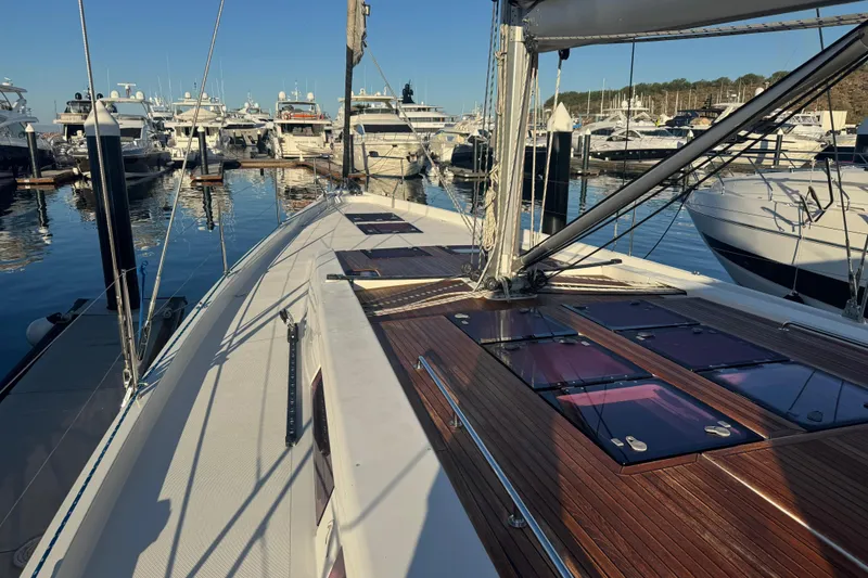  Yacht Photos Pics Sailing yacht Hanse 575, 2013 model, docked in a marina with other boats.