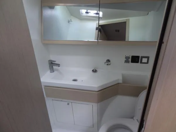 Aita Pea Pea III Yacht Photos Pics Modern bathroom in 2020 Beneteau Oceanis 46.1 yacht with sleek fixtures and mirror.