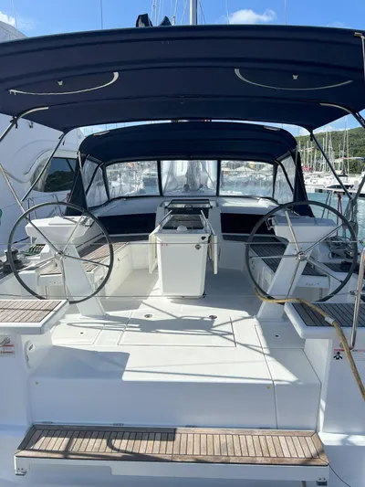 Aita Pea Pea III Yacht Photos Pics 2020 Beneteau Oceanis 46.1 yacht cockpit with dual steering wheels and canopy.