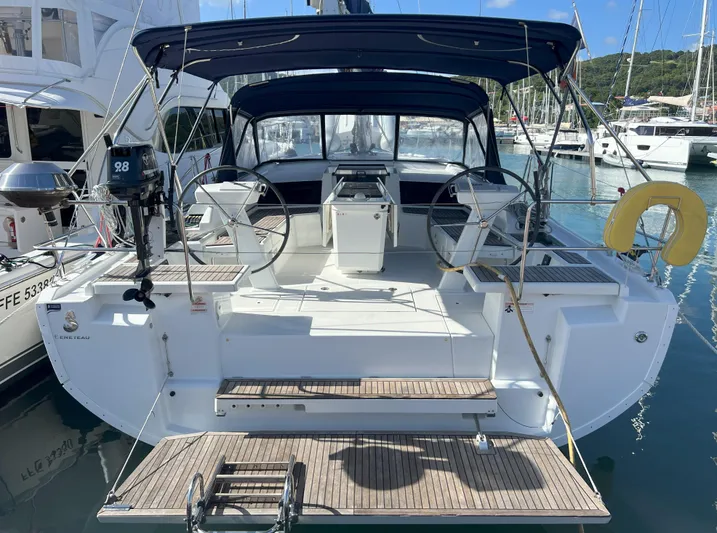 Aita Pea Pea III Yacht Photos Pics 2020 Beneteau Oceanis 46.1 yacht docked at marina, featuring dual steering wheels.