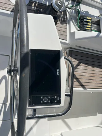 Aita Pea Pea III Yacht Photos Pics Beneteau Oceanis 46.1 2020 yacht helm with navigation system and wooden deck.