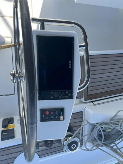 Aita Pea Pea III Yacht Photos Pics Beneteau Oceanis 46.1 2020 yacht helm with navigation controls and steering wheel.