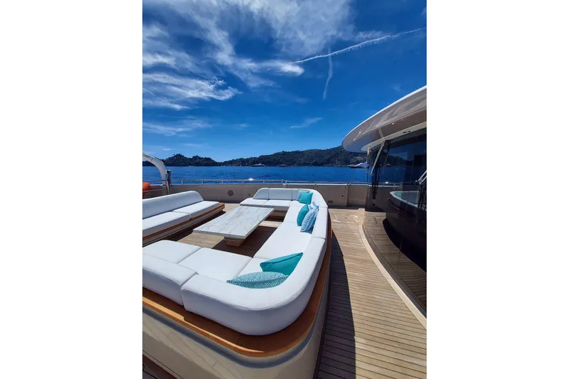  Yacht Photos Pics Luxurious 2022 Benetti B.NOW yacht deck with elegant seating and ocean view.
