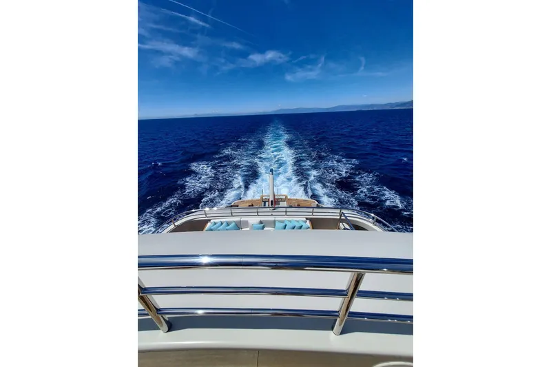  Yacht Photos Pics Luxury Benetti B.NOW yacht cruising on open sea, 2022 model, with clear blue skies.