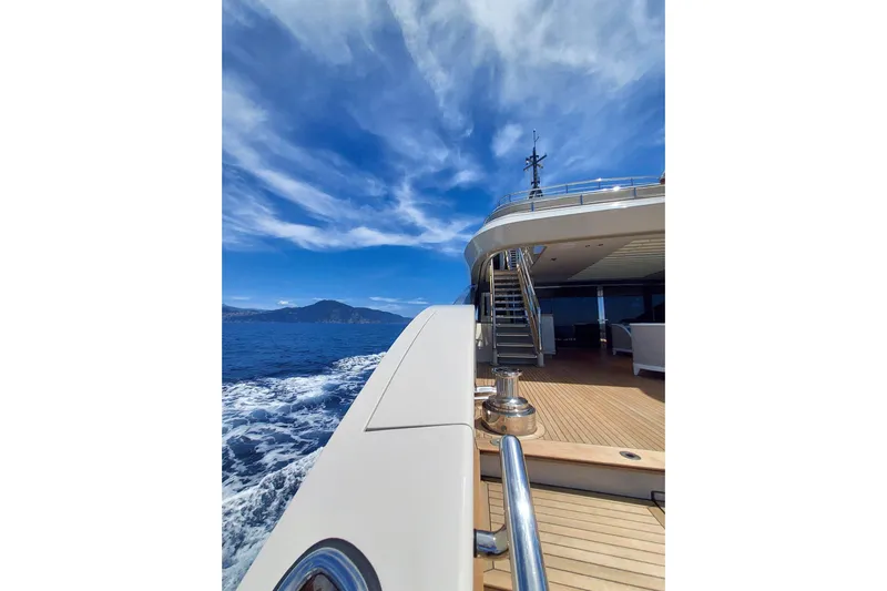  Yacht Photos Pics Luxurious Benetti B.NOW yacht cruising on open sea, 2022 model, under clear blue skies.