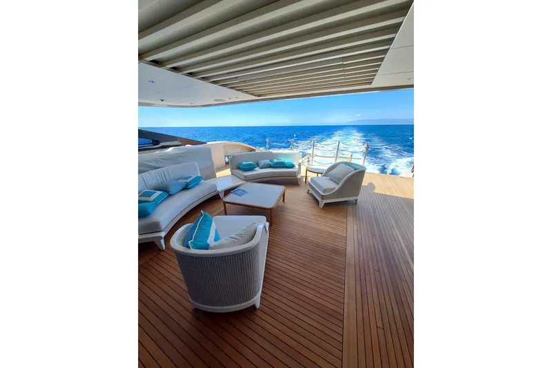  Yacht Photos Pics Luxurious Benetti B.NOW 2022 yacht deck with elegant seating and ocean view.
