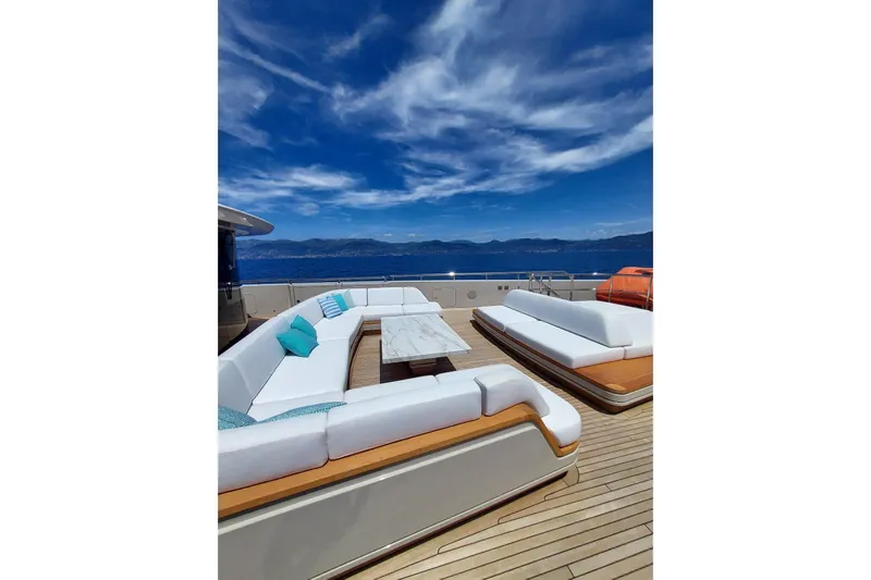  Yacht Photos Pics Luxurious Benetti B.NOW 2022 yacht deck with elegant seating and stunning ocean view.
