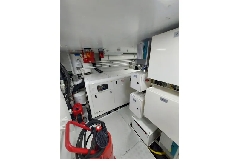  Yacht Photos Pics Engine room of 2022 Benetti B.NOW yacht with equipment and fire extinguisher.