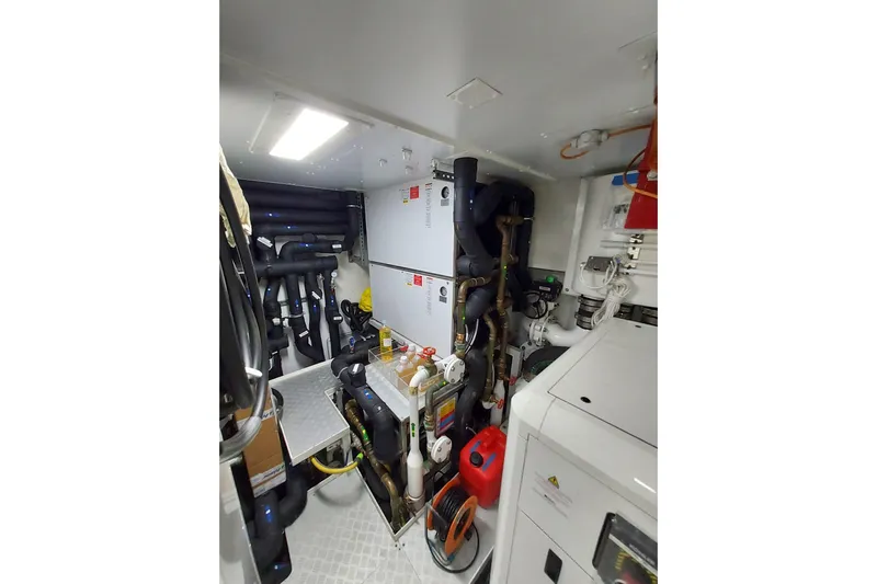  Yacht Photos Pics Engine room of 2022 Benetti B.NOW yacht with complex piping and machinery.