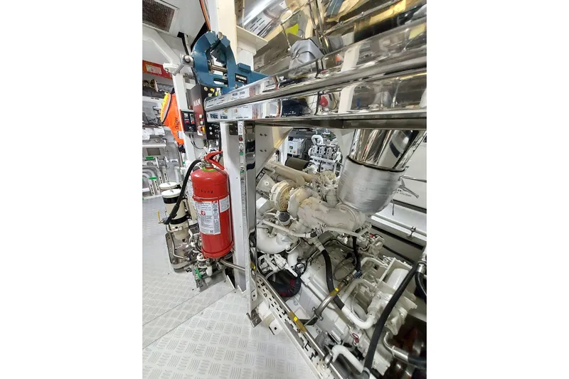  Yacht Photos Pics Engine room of 2022 Benetti B.NOW yacht with fire extinguisher and machinery.