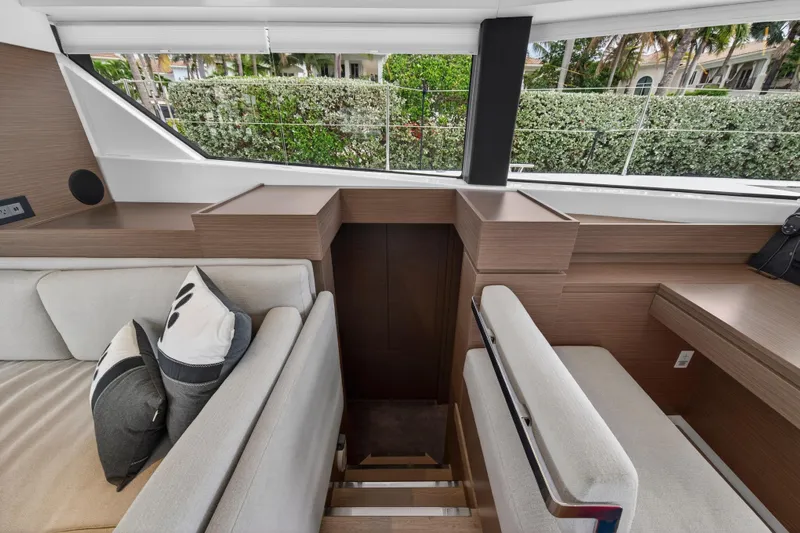  Yacht Photos Pics Interior of 2025 Leopard 46 yacht with modern seating and large windows.