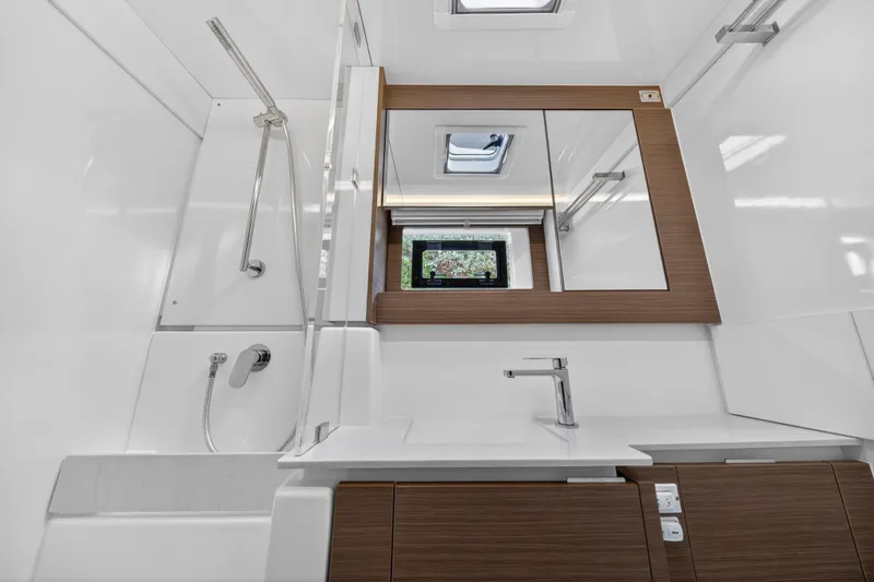  Yacht Photos Pics Modern bathroom in 2025 Leopard 46 yacht with sleek fixtures and wood accents.