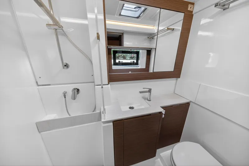  Yacht Photos Pics Modern bathroom in 2025 Leopard 46 yacht with sleek fixtures and wood accents.