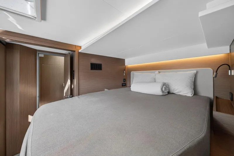  Yacht Photos Pics Luxurious bedroom interior of 2025 Leopard 46 yacht with modern design and ambient lighting.