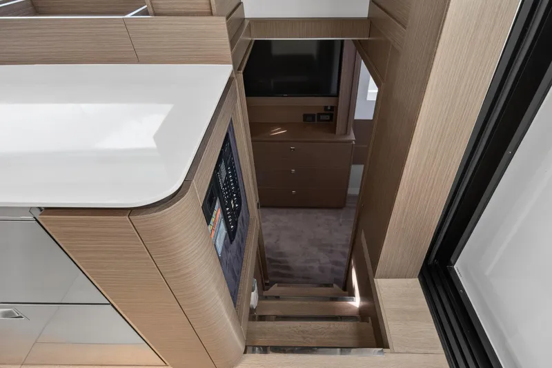  Yacht Photos Pics Interior of 2025 Leopard 46 yacht, featuring modern wood cabinetry and sleek design.