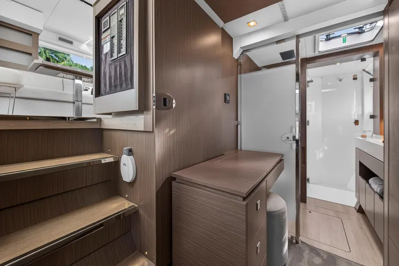  Yacht Photos Pics Modern interior of 2025 Leopard 46 yacht featuring sleek wood finishes and compact design.