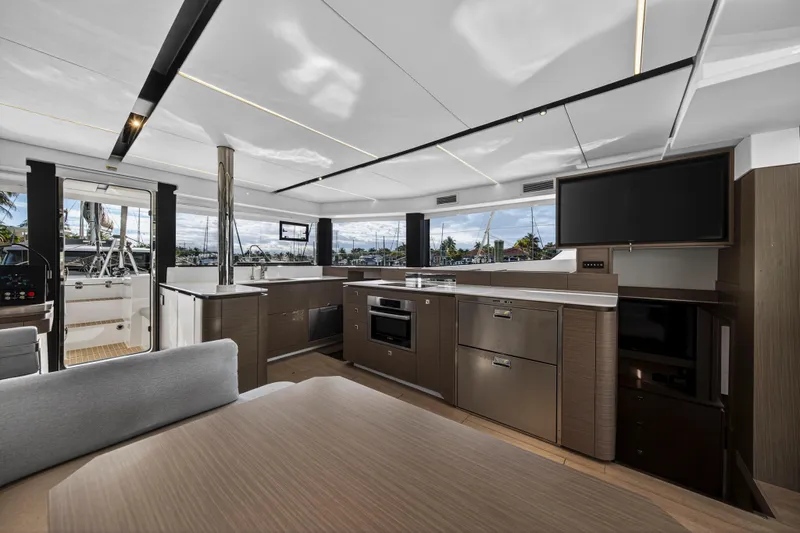  Yacht Photos Pics Luxurious interior of 2025 Leopard 46 yacht with modern kitchen and sleek design.