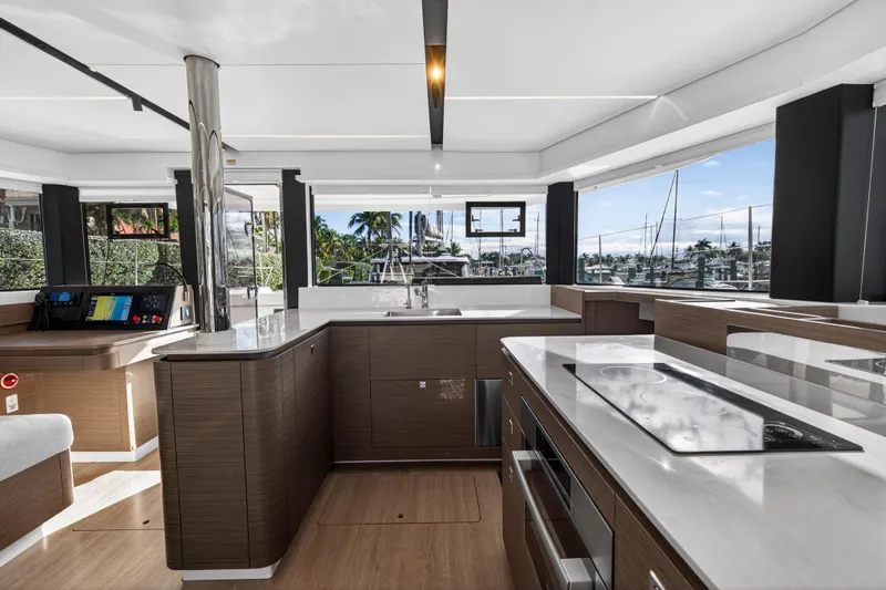  Yacht Photos Pics Luxurious interior of 2025 Leopard 46 yacht with modern kitchen and panoramic windows.