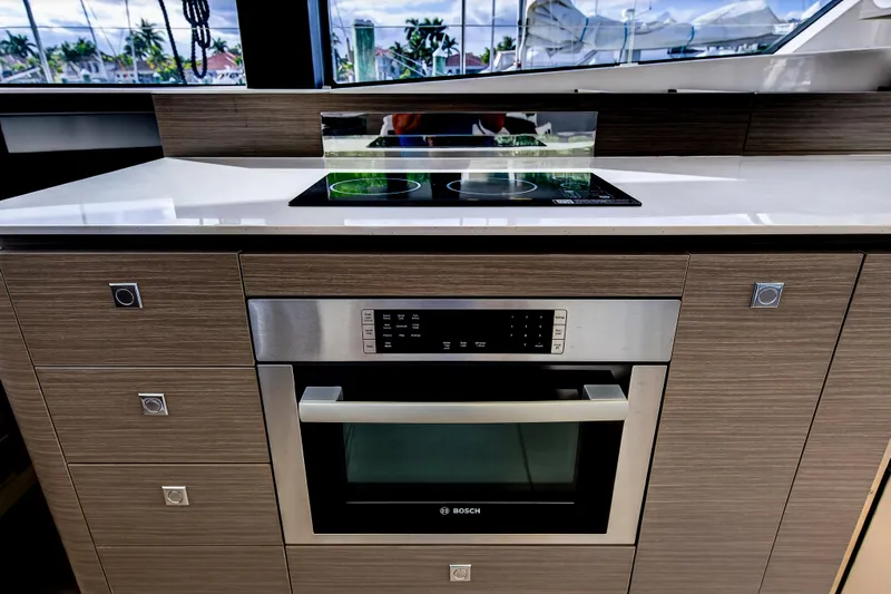  Yacht Photos Pics Modern kitchen in 2025 Leopard 46 yacht with Bosch oven and sleek cooktop.