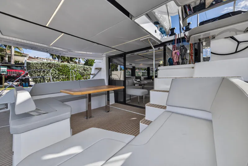  Yacht Photos Pics Luxurious 2025 Leopard 46 yacht interior with modern seating and dining area.