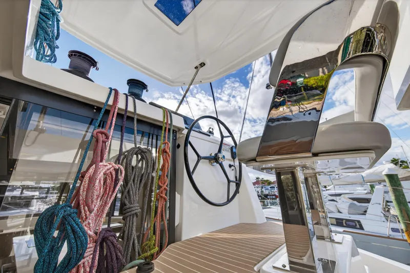  Yacht Photos Pics Helm of 2025 Leopard 46 yacht with ropes and steering wheel.