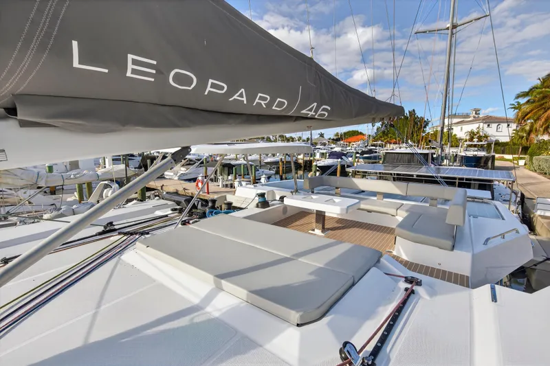  Yacht Photos Pics Luxurious 2025 Leopard 46 yacht docked, featuring spacious deck and modern design.