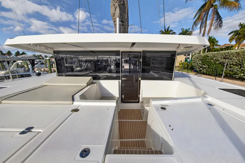  Yacht Photos Pics 2025 Leopard 46 yacht deck with modern design and spacious seating area.