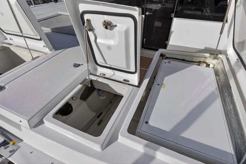  Yacht Photos Pics Open compartments on a 2025 Leopard 46 yacht, showcasing storage and mechanical access.