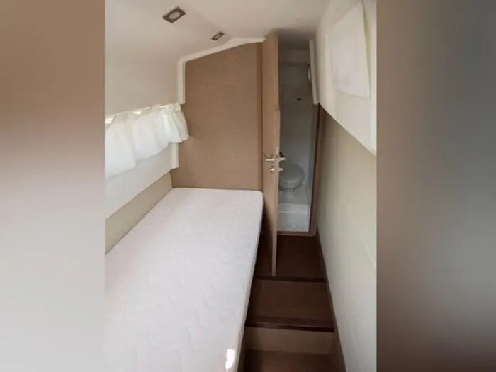  Yacht Photos Pics Interior of a 2016 Prestige 560 yacht with bed and bathroom.