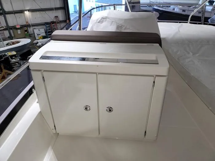  Yacht Photos Pics Interior view of a 2016 Prestige 560 yacht with storage compartment.