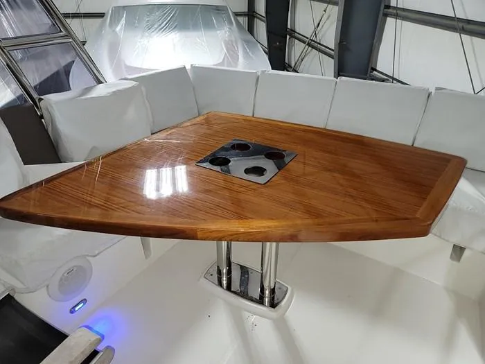  Yacht Photos Pics Luxurious wooden table on a 2016 Prestige 560 yacht.