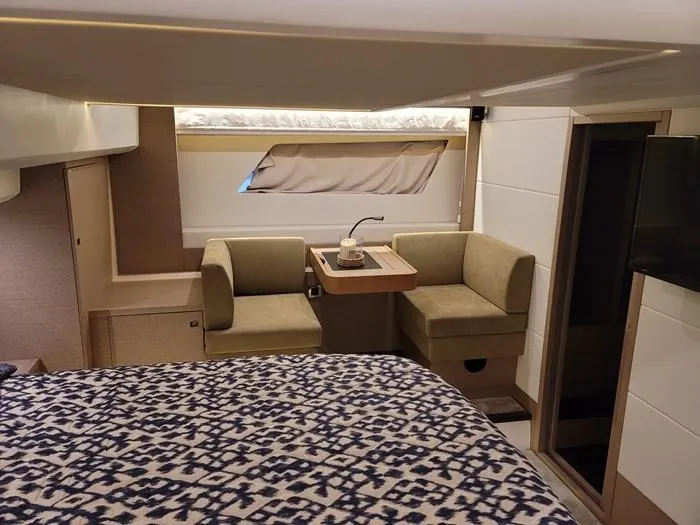  Yacht Photos Pics Interior of a 2016 Prestige 560 yacht with cozy seating area.
