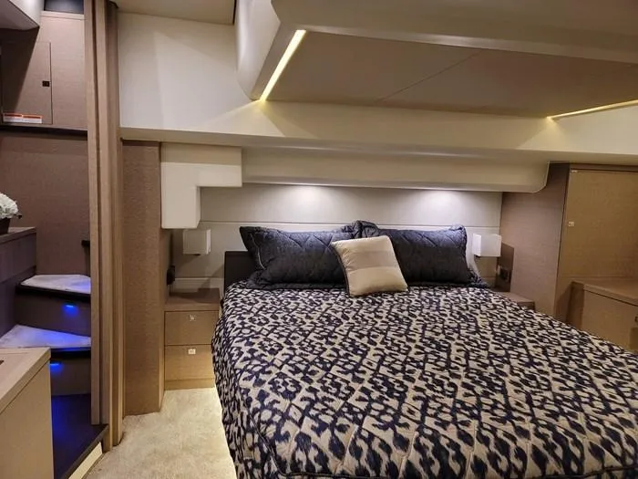  Yacht Photos Pics Luxurious bedroom on a 2016 Prestige 560 yacht.