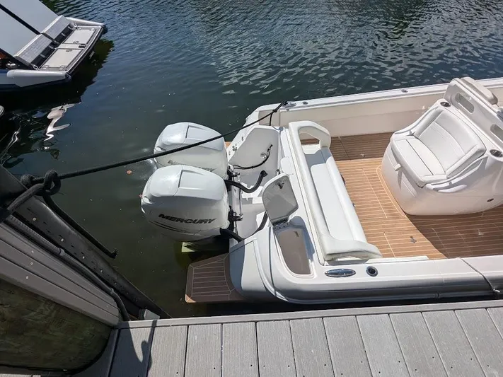  Yacht Photos Pics Intrepid 327 Center Console boat docked, featuring dual Mercury 400HP engines, 2017 model.