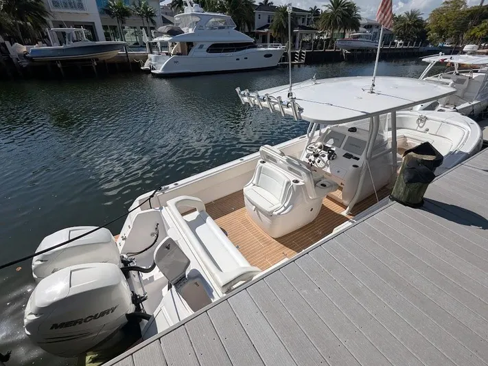  Yacht Photos Pics Intrepid 327 Center Console boat docked, featuring 400HP Mercury motors, 2017 model.