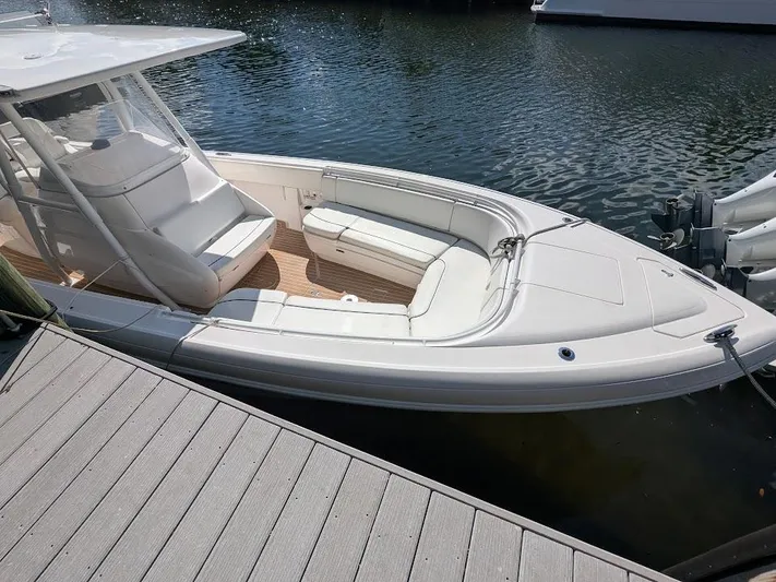  Yacht Photos Pics Intrepid 327 Center Console boat docked, 2017 model with 400HP motors, sleek white design.