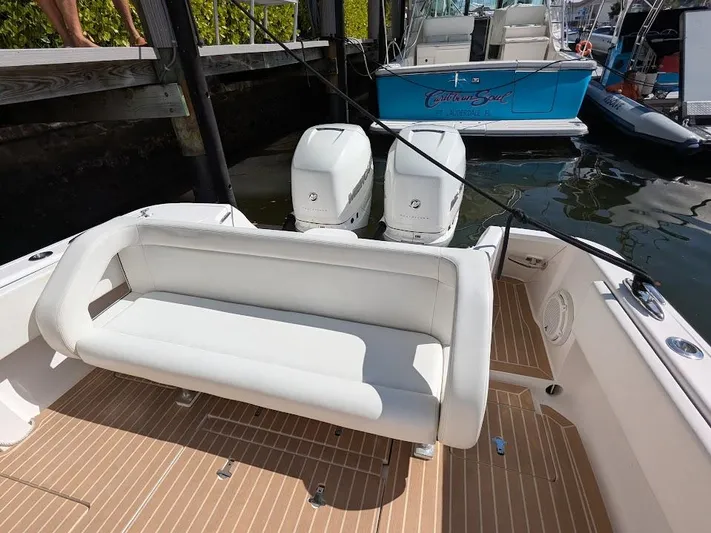  Yacht Photos Pics Intrepid 327 Center Console 2019 with 400HP motors, featuring a sleek white seating area.