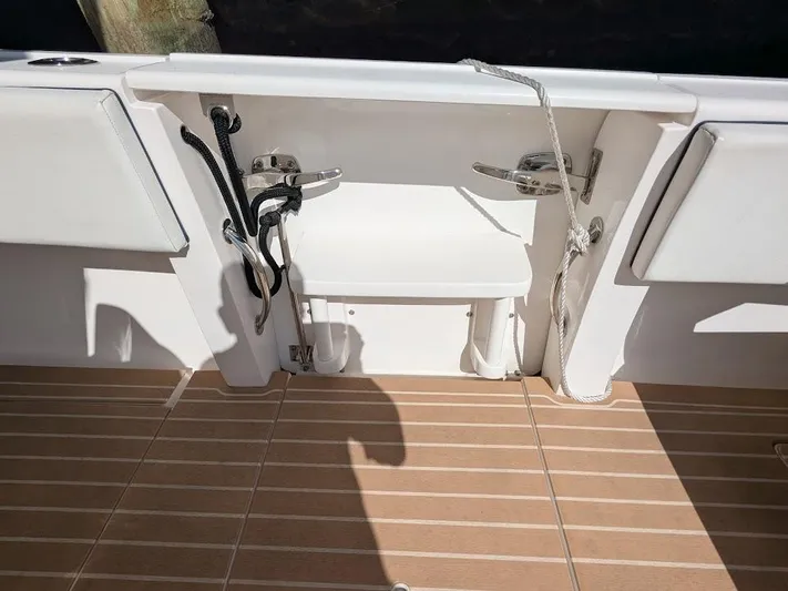  Yacht Photos Pics Intrepid 327 Center Console 2019 boat deck with ropes and seating, 2017 model.