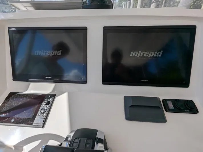  Yacht Photos Pics Intrepid 327 Center Console 2019 dashboard with dual Garmin screens and controls.