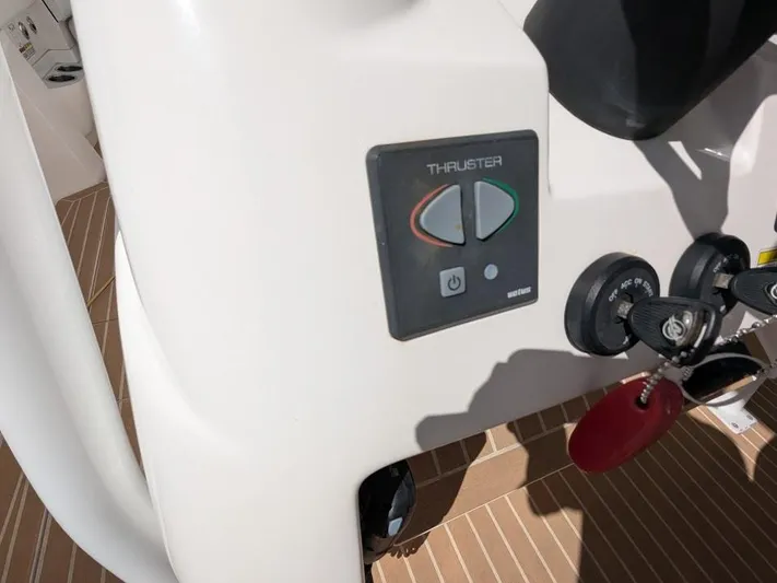  Yacht Photos Pics Control panel of 2017 Intrepid 327 Center Console boat with thruster and ignition keys.