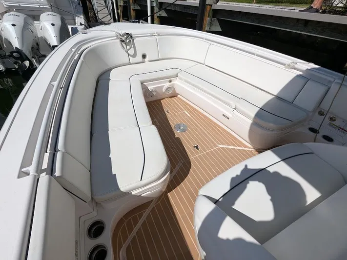 Yacht Photos Pics Intrepid 327 Center Console 2019, spacious seating, teak flooring, luxury boat interior.